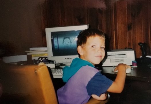 Young Mark sitting at a computer